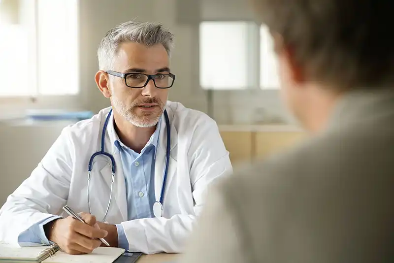 doctor with patient in room
