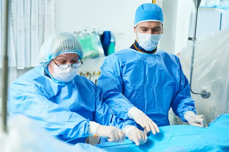 doctors in procedure room with patient