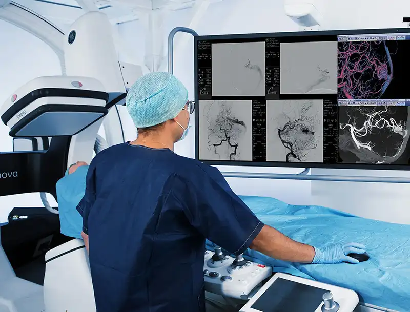 radiologist viewing results on screen after scan
