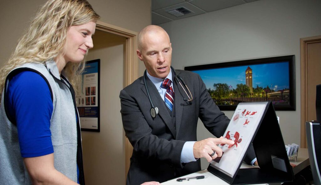 radiologist with client going over procedure